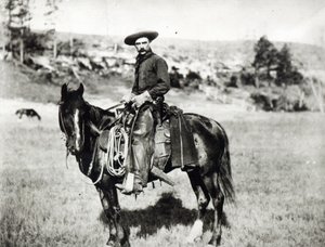 Cowboy che cavalca un cavallo in Montana, USA, c. 1880